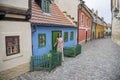 Cobblestone street and colorful 16th century cottages of artisans known as Golden Lane inside the castle walls Prague Czech Royalty Free Stock Photo