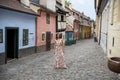 Cobblestone street and colorful 16th century cottages of artisans known as Golden Lane inside the castle walls Prague Czech Royalty Free Stock Photo