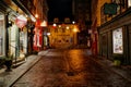 Cobblestone Street at Night With Shops and Funicular Entrance in Quartier Petit Champlain, Quebec City Royalty Free Stock Photo