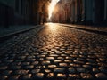Cobblestone street with the sun setting behind it