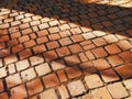 cobblestone sunset street dusk evening stone block road paver blocks night shadows sidewalk Royalty Free Stock Photo