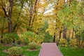Cobblestone walkway in autumn park. Royalty Free Stock Photo