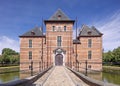 Cobblestone walkway to the gate of an ancient castle.