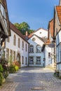 Cobblestoned street with white houses in Tecklenburg Royalty Free Stock Photo