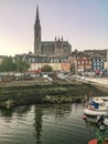 Cobh Cathedral colored houses landscape clear sky reflection