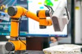 Cobot (Collaborative Robot) with 3D scaner is scaning prototype in R&D shop.