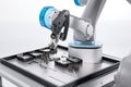 cobot performing delicate task, such as soldering or together parts