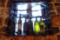 Cobweb covered wine bottles in wine cellar by the Royalty Free Stock Photo