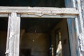 Cobweb in an old window frame. Abandoned house in the village. Broken window