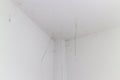 Cobwebs growing up in the corner of the room wall Royalty Free Stock Photo