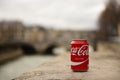 Coca cola can with Paris in blurry background Royalty Free Stock Photo