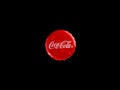 Coca-Cola cap in water drops on a classic glass bottle isolated on a black background. Moscow, August, 2020