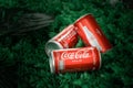 Ayutthaya, Thailand-25June2020: Coca-Cola Classic in a glass bottle and can on dark toned cement Background. Coca Cola, Coke is th Royalty Free Stock Photo