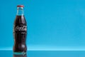 Coca Cola drink on blue background Royalty Free Stock Photo