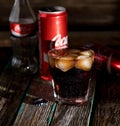 Coca cola with ice, bottle, glass, cup