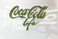 Coca cola life on glossy office wall realistic texture