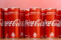 Coca-Cola logo printed on aluminium cans and placed on shopping mall table Royalty Free Stock Photo