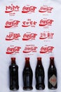 Coca Cola retro bottles, various languages on background
