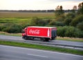 Coca Cola Truck with driving along highway. Goods Delivery by roads. Spedition Ã¢â¬â SÃÂ¶llner Group. Services and Transport Royalty Free Stock Photo