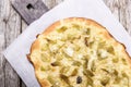 Coca - traditional Catalan savory cake, similar to pizza with baked sweet green pepper, fried onion and cheese