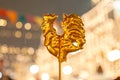 Cockerel candy on a stick. Hard candy rooster. Rooster candy symbol