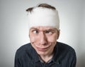 Man with bandage on his head