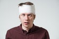 Man with bandage on his head