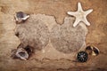 Cockleshells, starfish, compass and old paper Royalty Free Stock Photo