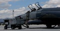 Cockpit of a modern grey NATO fighter jet plane parked at military air base