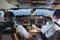 The cockpit of a modern passenger aircraft in flight. Pilots at work Royalty Free Stock Photo