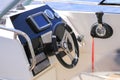 Cockpit motor boat with steering wheel and throttle control Royalty Free Stock Photo