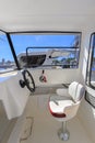 Cockpit motor boat with steering wheel and throttle control Royalty Free Stock Photo