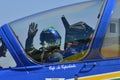 Cockpit pilot waving close-up minutes before takeoff