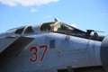 The cockpit of russian fighter-interceptor MiG-31BM RF-95448 with the airborne number 37 red against the blue sky. Close-up