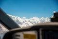 The cockpit of a small aircraft flying at seven thousand feet with the selective focus on the alto cumulus clouds. Royalty Free Stock Photo