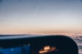 Cockpit of a small plane flying over the airport runway at sunset Royalty Free Stock Photo