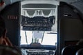 Cockpit view of Beechcraft 1900D in flight from passanger seat