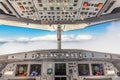 cockpit view of a commercial jet airliner with pilot in cruise phase of flight Royalty Free Stock Photo