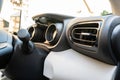 Cockpit view of a new, Japanese hybrid hatchback car. Showing the dual LCD dashboard and air con vent. Royalty Free Stock Photo