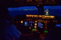 Cockpit view of a passenger airplane shorly before landing with the runway in sight at night. 11/10/2014 - Schiphol, Netherlands