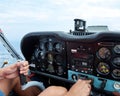 Cockpit view of a sports plane. Amateur pilot holding a hand control lever