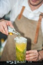 Cocktail bar bartender making mojito