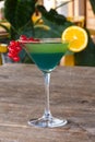 Cocktail blue curacao green currant orange old wooden table juice Royalty Free Stock Photo