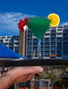 Cocktail blue curacao green currant orange sand beach sea hand tray waiter Royalty Free Stock Photo