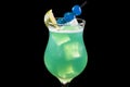 Cocktail blue Hawaii in a glass with ice cubes and slice lime Royalty Free Stock Photo