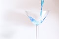 Cocktail with blue liquid in glass. Royalty Free Stock Photo