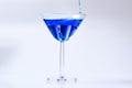 Cocktail with blue liquid in glass. Royalty Free Stock Photo