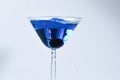 Cocktail with blue liquid in glass. Royalty Free Stock Photo