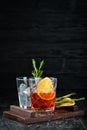 Cocktail Bulvardye. Whiskey and Orange Liquor. Alcoholic cocktail in a glass. On a wooden background. Royalty Free Stock Photo
