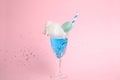 Cocktail with cotton candy in glass on background Royalty Free Stock Photo